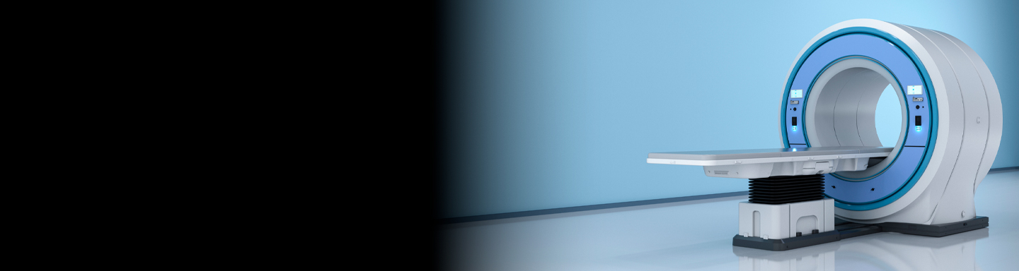 A state-of-the-art MRI scanner is positioned in a clean, brightly lit medical room.